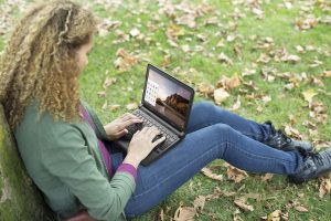 Girl Sitting Outside with a Chromebook 11 Notebook