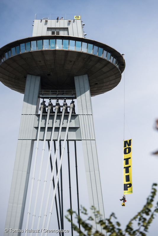 Ten climbers from Austria, Slovakia and Croatia scale Bratislava’s UFO tower over the Danube to display a banner reading “NO TTIP”, as ministers meet in the city below to decide the fate of EU trade deals with the US and Canada.